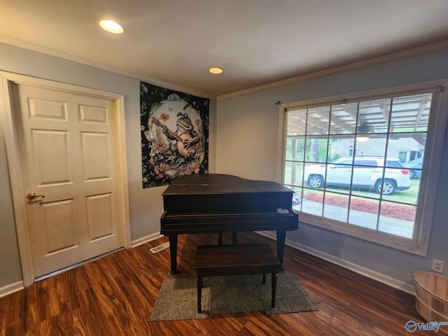 living area with crown molding, baseboards, and dark wood-type flooring