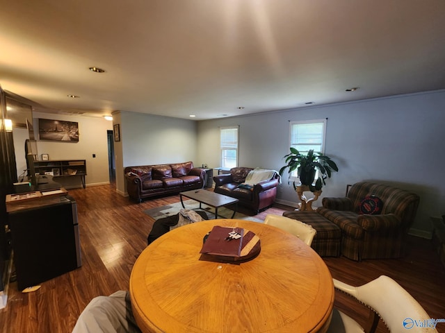 dining space with recessed lighting, baseboards, and wood finished floors