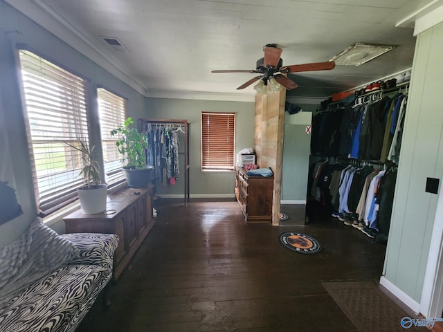 interior space featuring a ceiling fan, visible vents, baseboards, a closet, and hardwood / wood-style floors