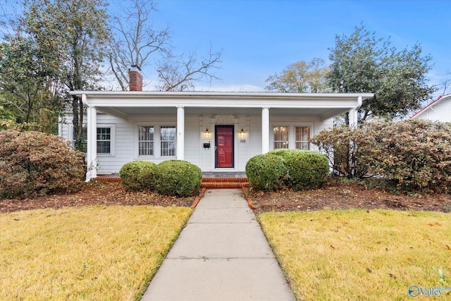 bungalow-style house with a front yard