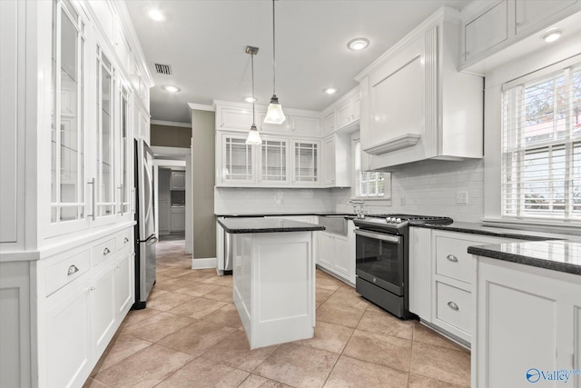 kitchen featuring backsplash, ornamental molding, stainless steel appliances, decorative light fixtures, and white cabinetry