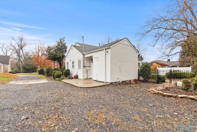 view of side of home featuring a patio