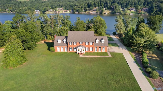 aerial view featuring a water view and a forest view