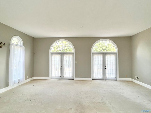 interior space with plenty of natural light and french doors