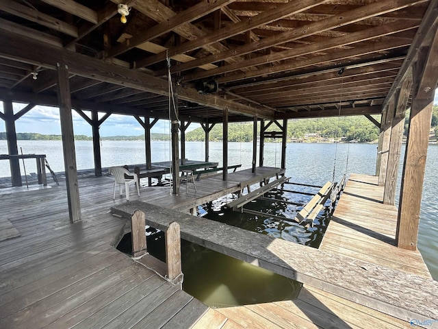 view of dock with a water view and boat lift