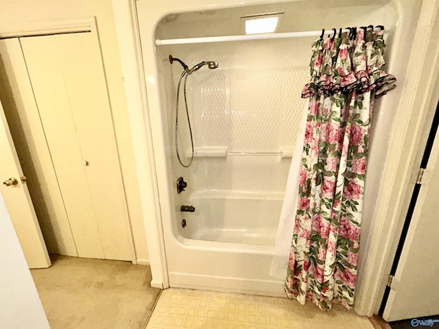 bathroom featuring tile patterned floors and shower / bath combo with shower curtain