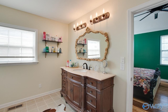 bathroom featuring tile patterned flooring, ceiling fan, and vanity