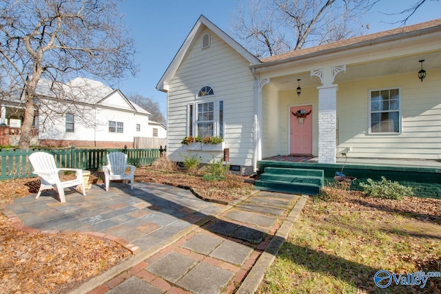 property entrance featuring a patio