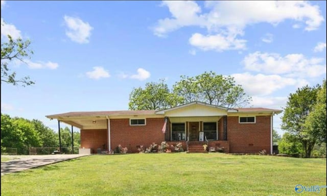 view of front of home featuring a front yard, a carport, and covered porch