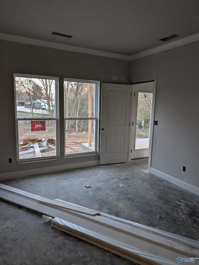 interior space featuring plenty of natural light and ornamental molding