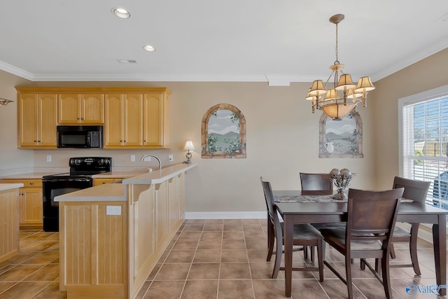 kitchen with black appliances, a peninsula, light countertops, and light brown cabinetry