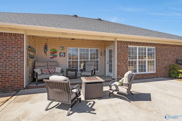 view of patio / terrace featuring an outdoor living space with a fire pit