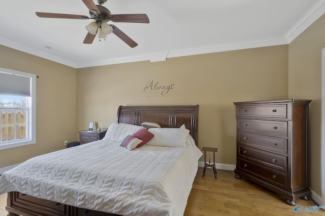 bedroom with ceiling fan, light wood-style floors, baseboards, and ornamental molding