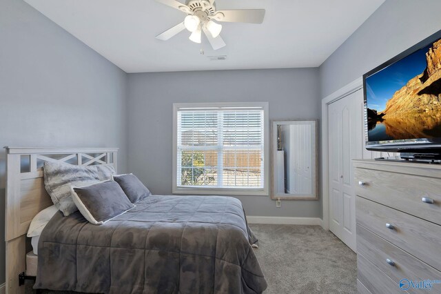 bedroom featuring visible vents, baseboards, carpet, and a ceiling fan