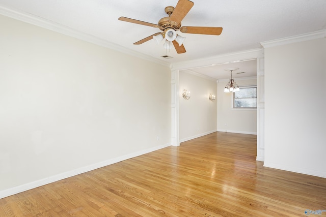 empty room with crown molding, ceiling fan with notable chandelier, and light wood-type flooring