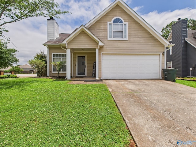 201 Turnbrook Dr SW, Huntsville, AL 35824 - traditional home featuring concrete driveway, a front lawn, an attached garage, and a chimney