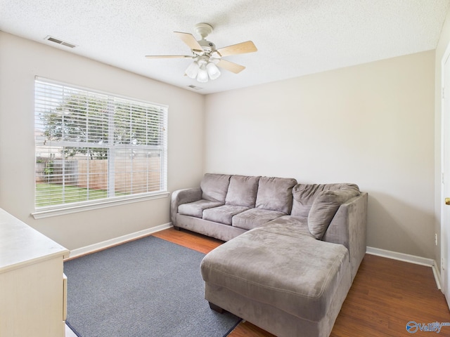 201 Turnbrook Dr SW, Huntsville, AL 35824 - living room with wood finished floors, a ceiling fan, and a textured ceiling