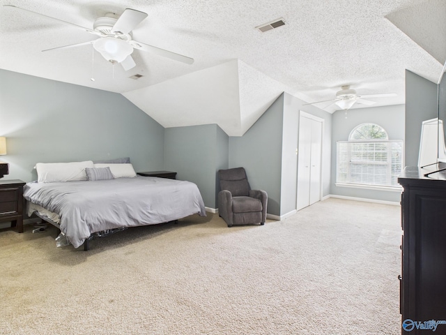 201 Turnbrook Dr SW, Huntsville, AL 35824 - carpeted bedroom featuring vaulted ceiling, a ceiling fan, a textured ceiling, and a closet