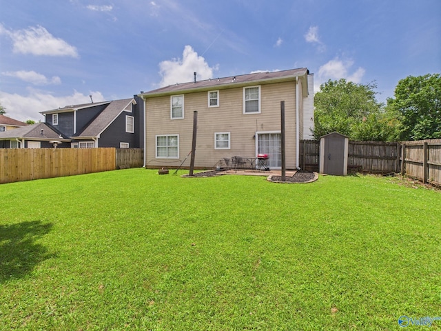 201 Turnbrook Dr SW, Huntsville, AL 35824 - rear view of house with a fenced backyard, a shed, and a patio