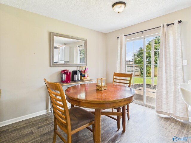 201 Turnbrook Dr SW, Huntsville, AL 35824 - dining space with wood finished floors and a textured ceiling