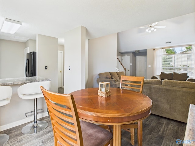 201 Turnbrook Dr SW, Huntsville, AL 35824 - dining area featuring wood finished floors, stairs, and ceiling fan