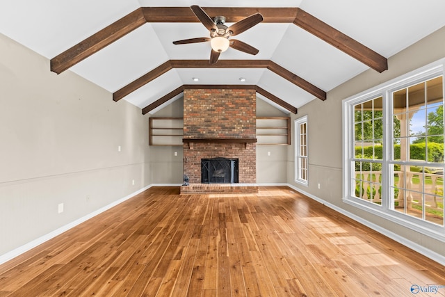 2009 SW Danbury Cir SW, Huntsville, AL 35803 - unfurnished living room featuring wood-type flooring, ceiling fan, a fireplace, and baseboards
