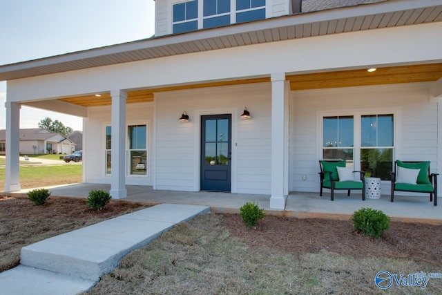 property entrance featuring covered porch