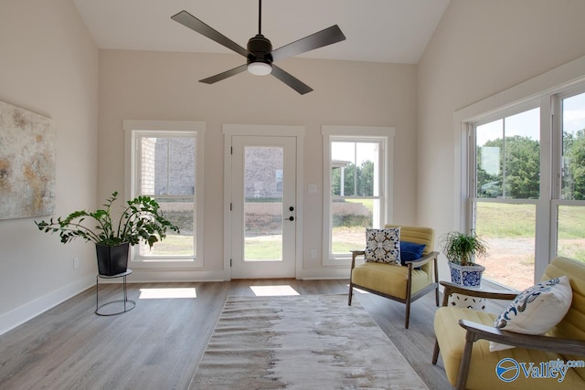 doorway to outside with light hardwood / wood-style floors, ceiling fan, and plenty of natural light