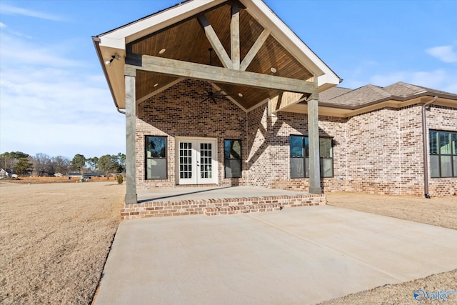 rear view of house featuring a patio and french doors
