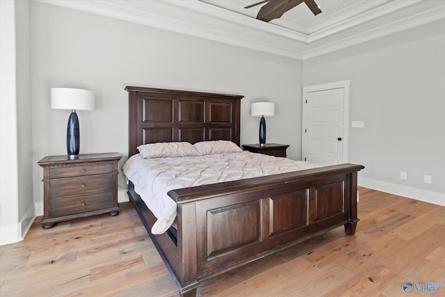 bedroom with crown molding, ceiling fan, and light wood-type flooring