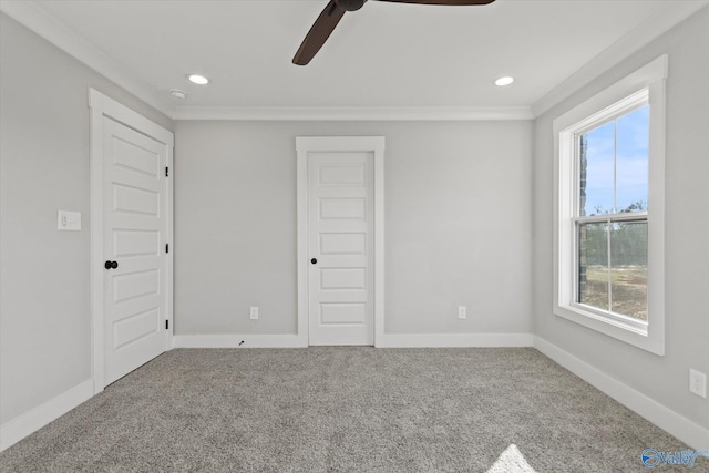 unfurnished bedroom with crown molding, ceiling fan, and carpet floors
