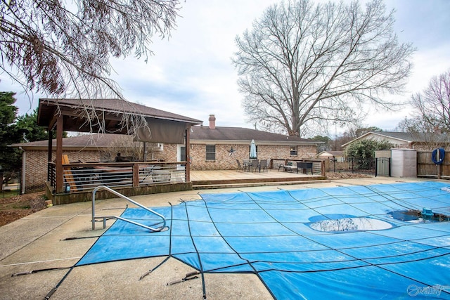 view of swimming pool featuring a deck