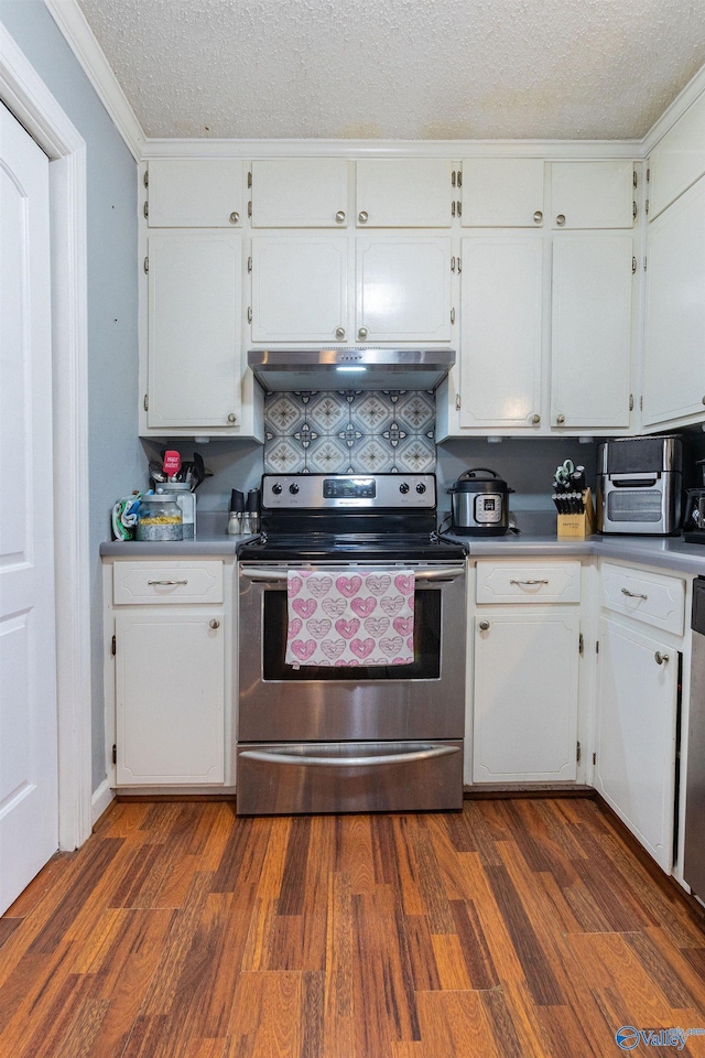 kitchen featuring dark wood-type flooring, crown molding, a textured ceiling, electric range, and white cabinets