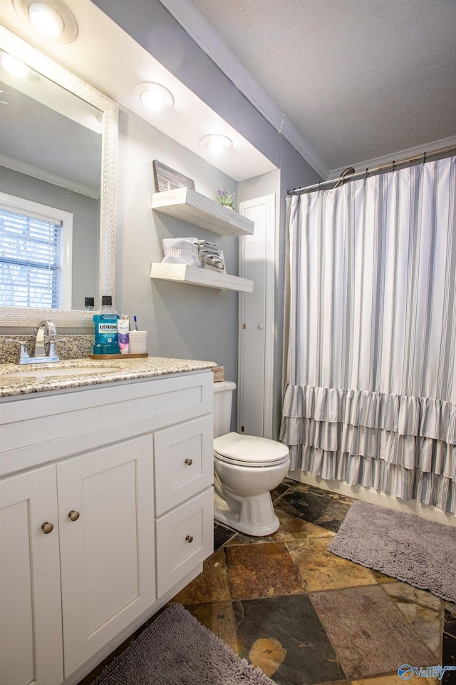 bathroom featuring walk in shower, toilet, a textured ceiling, ornamental molding, and vanity