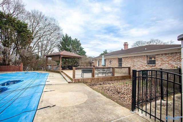 exterior space with a gazebo and a patio area