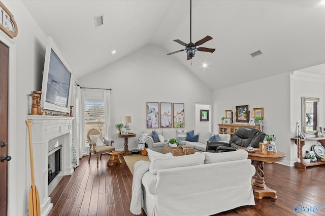 living room featuring ceiling fan, high vaulted ceiling, dark hardwood / wood-style floors, and a fireplace