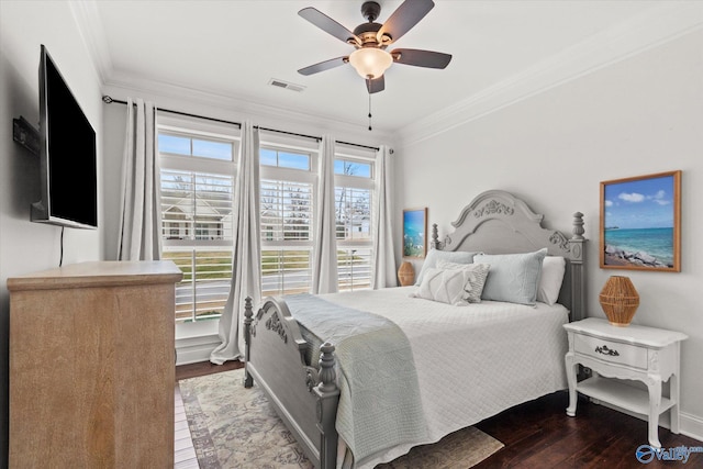 bedroom with hardwood / wood-style flooring, crown molding, and ceiling fan