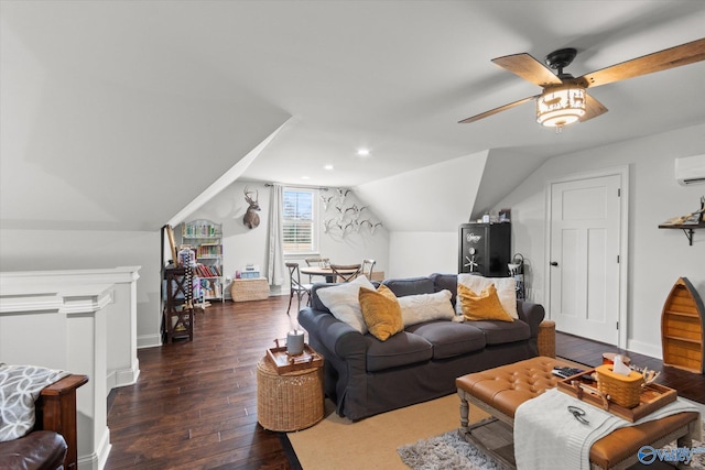 living room featuring dark hardwood / wood-style flooring, lofted ceiling, an AC wall unit, and ceiling fan