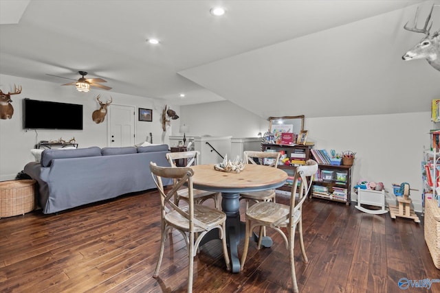 dining area with vaulted ceiling, ceiling fan, and dark hardwood / wood-style flooring