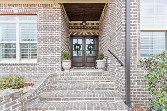 property entrance featuring french doors