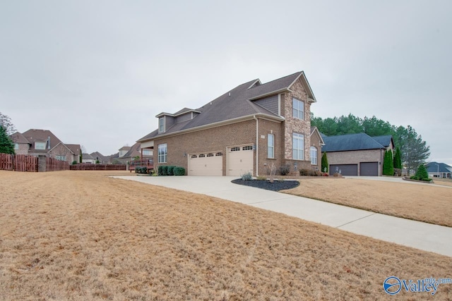 view of side of property with a garage