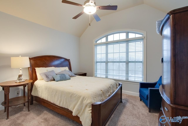 bedroom with ceiling fan, light colored carpet, and lofted ceiling