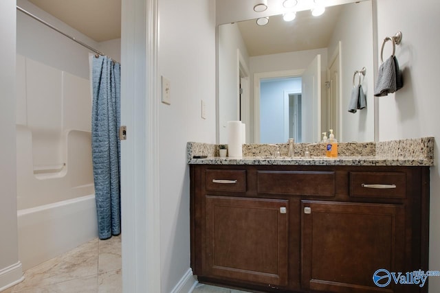 bathroom with shower / bath combo and vanity