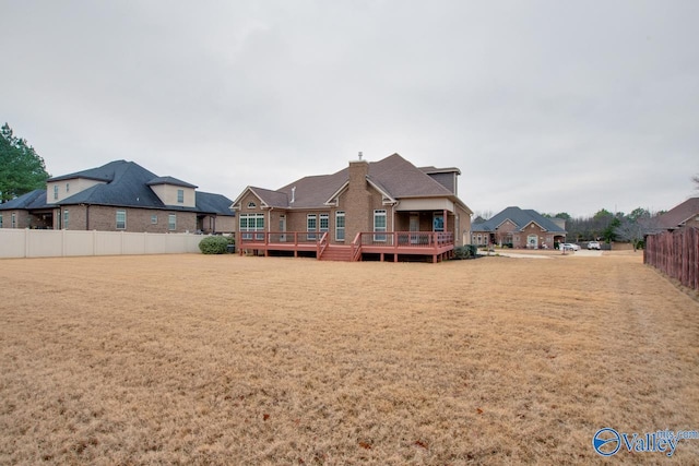 rear view of house featuring a deck