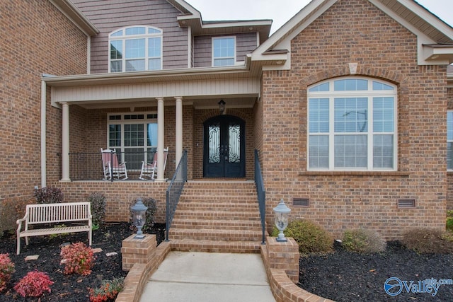 entrance to property with covered porch