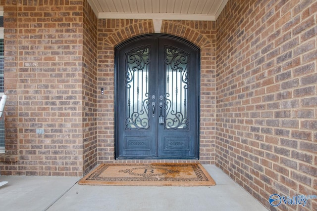 property entrance featuring french doors