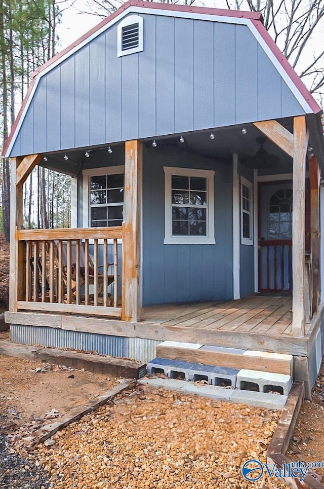 rear view of house with covered porch