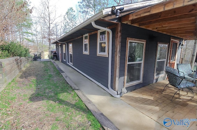 view of home's exterior featuring a wooden deck