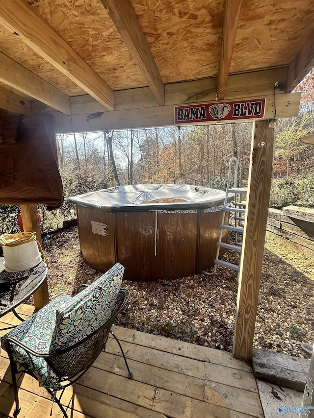 deck featuring a hot tub