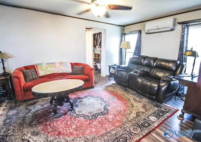 living room featuring hardwood / wood-style flooring, ceiling fan, ornamental molding, and a wall mounted AC